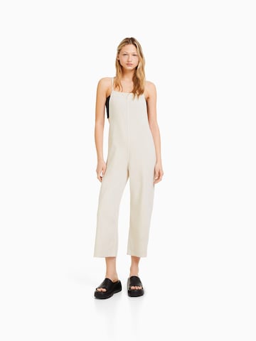 Bershka Loose fit Dungaree jeans in Beige