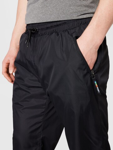 Effilé Pantalon de sport 'PORTAS' Rukka en noir