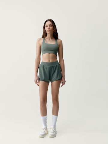 Born Living Yoga Slimfit Sportbroek 'Padma 2.0' in Groen: voorkant