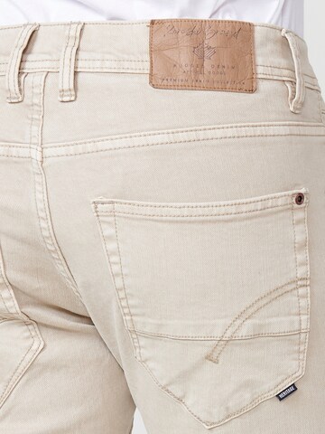 Coupe slim Jean KOROSHI en beige