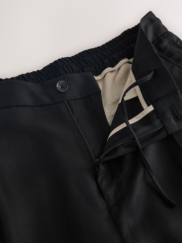 Loosefit Pantaloni con pieghe 'N. Premium' di Next in nero