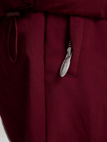 AND1 Zúžený strih Nohavice - Červená