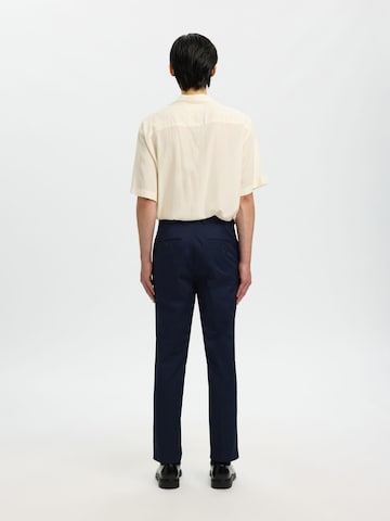 SELECTED - regular Pantalón de pinzas 'Selected X Hotel Amour' en azul