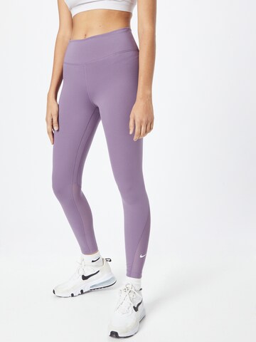 NIKE Skinny Spodnie sportowe 'One' w kolorze fioletowy: przód