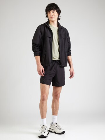 PUMA Koszulka funkcyjna 'Essentials' w kolorze zielony