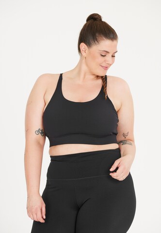 Q by Endurance Medium Support Sport-BH 'Thalia' in Schwarz: Vorderseite