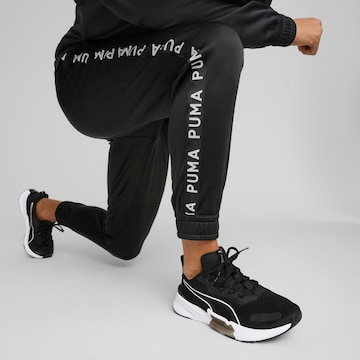 PUMA Tapered Sportbroek in Zwart