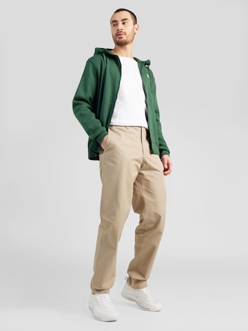 Regular Pantalon chino Nike Sportswear en vert