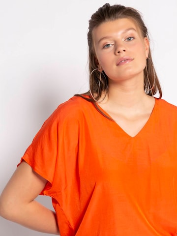 Studio Untold Blus i orange