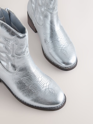 Next - Botas en plata