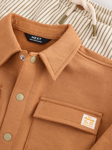 Set Next en marron