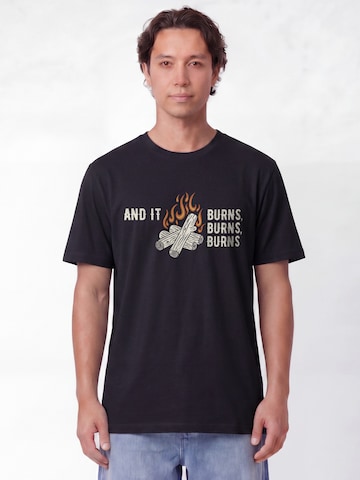 T-Shirt 'And It Burns' Watapparel en noir : devant