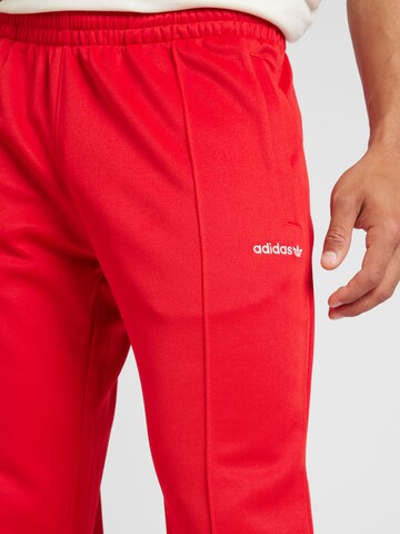 ADIDAS ORIGINALS Regular Trousers in Red