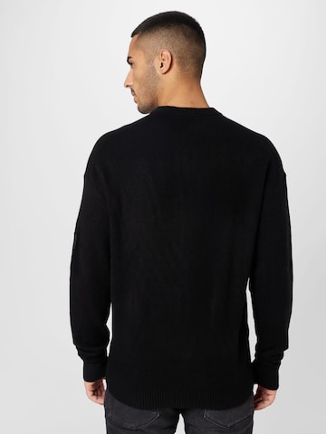 Calvin Klein كنزة صوفية بلون أسود