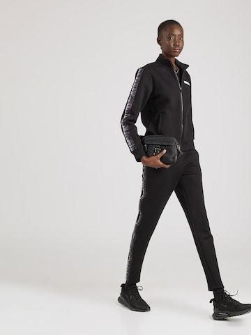 Survêtement EA7 Emporio Armani en noir : devant