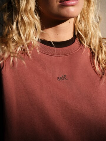 Sweat-shirt self. en marron