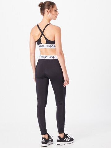 Skinny Pantaloni sport de la HKMX pe negru