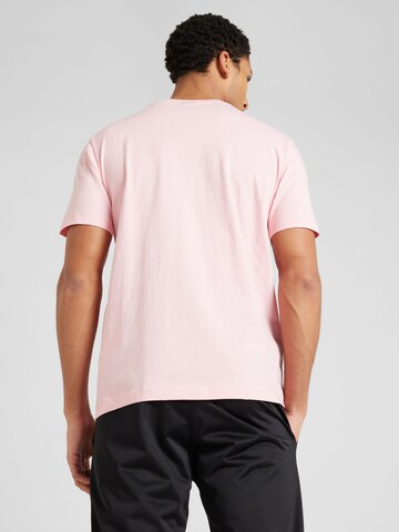 Maglietta di Champion Authentic Athletic Apparel in rosa