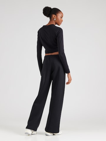 Wide leg Pantaloni 'PHNX FLC' di Nike Sportswear in nero