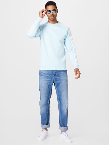 ADIDAS ORIGINALSRegular Fit Sweater majica 'Adicolor Classics 3-Stripes' - plava boja