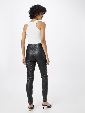 Skinny Pantaloni 'Aslimah' de la BOSS Orange pe negru