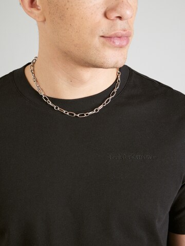 PEAK PERFORMANCE - Camiseta en negro