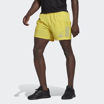 Regular Pantalon de sport 'Own the Run' ADIDAS SPORTSWEAR en jaune : devant