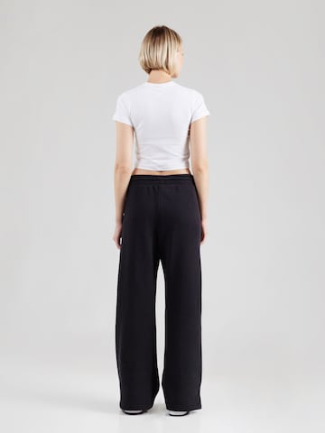 Wide leg Pantaloni 'PHNX FLC' de la Nike Sportswear pe negru