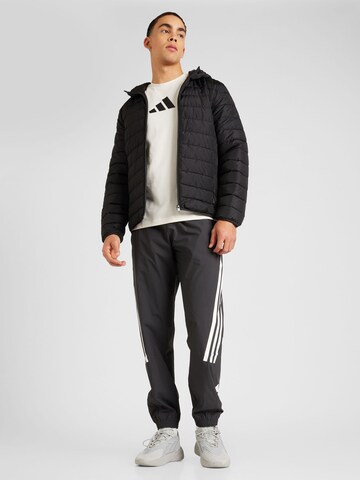 ADIDAS SPORTSWEAR Tapered Sportbyxa i svart