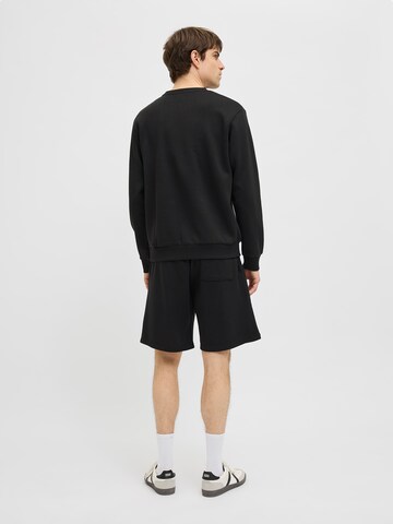 JJ Rebel - Loosefit Pantalón 'JREBCARLOS' en negro