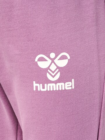 Effilé Pantalon de sport 'APPLE' Hummel en violet