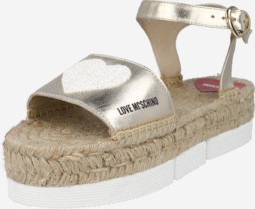 Love Moschino Sandals in Gold: front