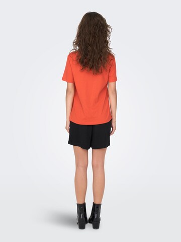 ONLY - Camiseta 'DUFFY' en naranja