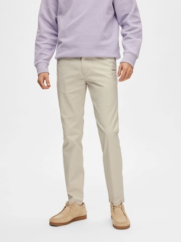 Slimfit Pantaloni '16087663' di SELECTED in beige