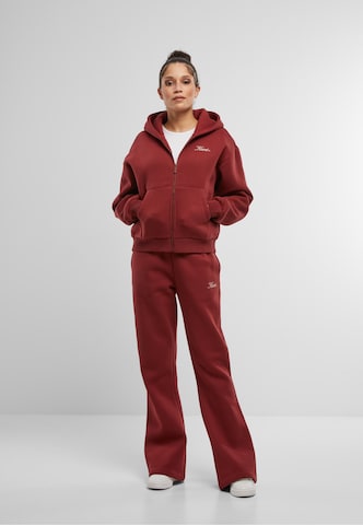 évasé Pantalon 'Script' Karl Kani en rouge