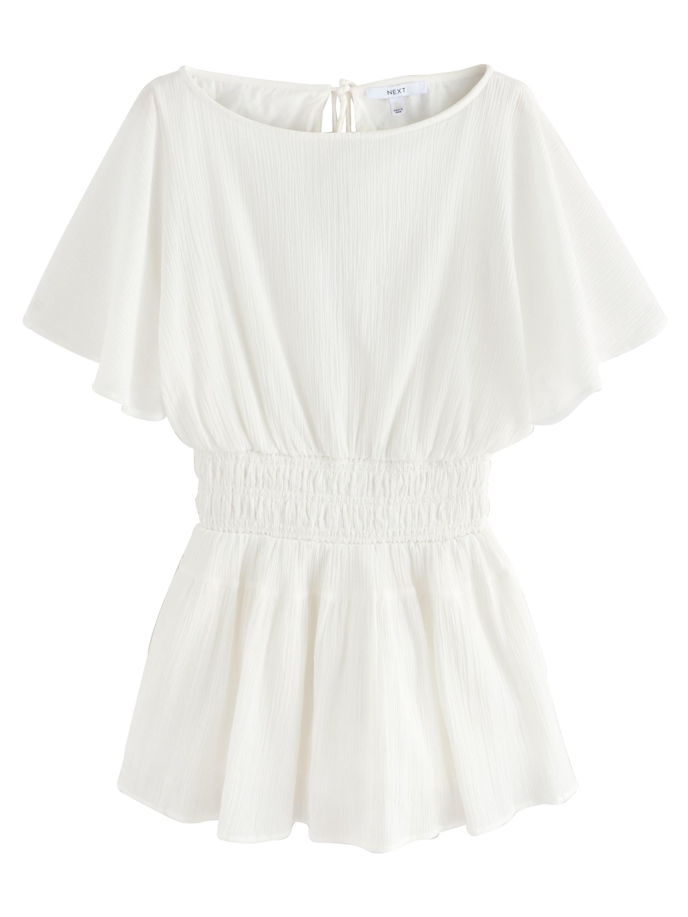 Salopeta de la Next pe alb: față