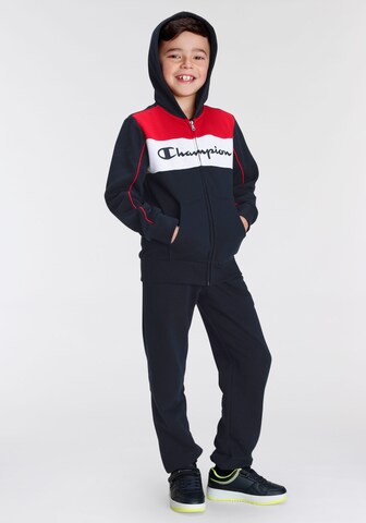 Champion Authentic Athletic Apparel Tracksuit in Blue: front