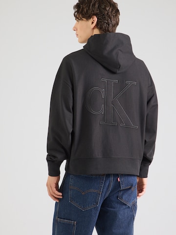 Bluză de molton de la Calvin Klein Jeans pe negru: față