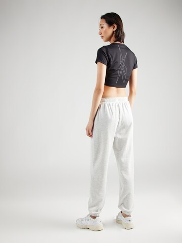 Tapered Pantaloni sportivi 'Ruthie' di Athlecia in bianco