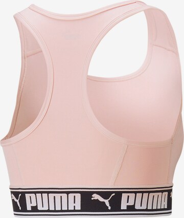 Bustino Reggiseno sportivo di PUMA in rosa