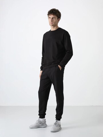 Tuta da jogging di Tommy Life in nero