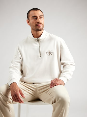 Calvin Klein Jeans Mikina – béžová: přední strana