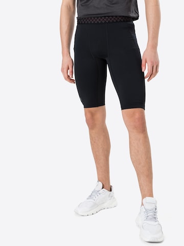 UNDER ARMOUR Skinny Workout Pants in Black: front