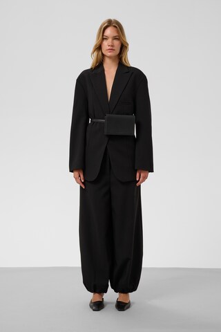SOAKED IN LUXURY - Perna larga Calças 'Corinne' em preto