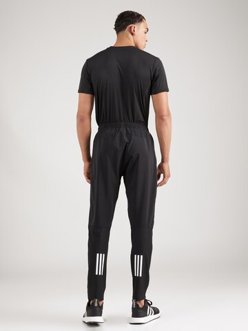 ADIDAS PERFORMANCE Tapered Sportbroek 'Own The Run' in Zwart