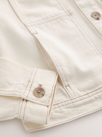 Next Přechodná bunda – béžová