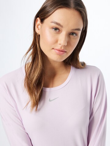 NIKE - Camiseta funcional en rosa