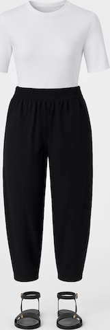 Touche Prive Tapered Trousers in Black: front