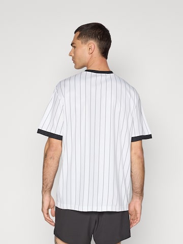 PUMA Performance Shirt 'Essentials' in White