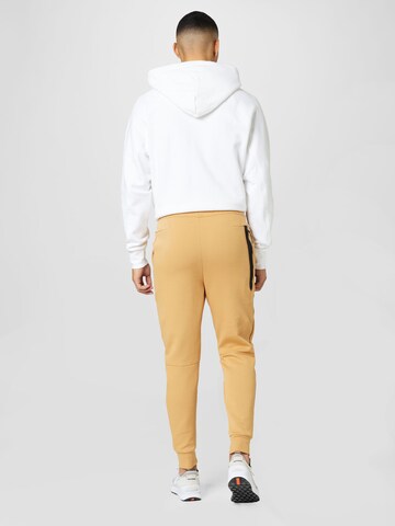 Nike Sportswear Tapered Broek in Beige